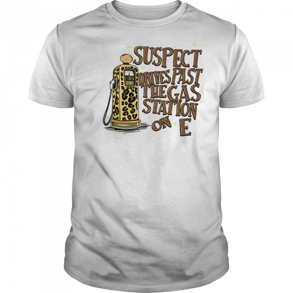 Suspect drives past the gas station on E shirt